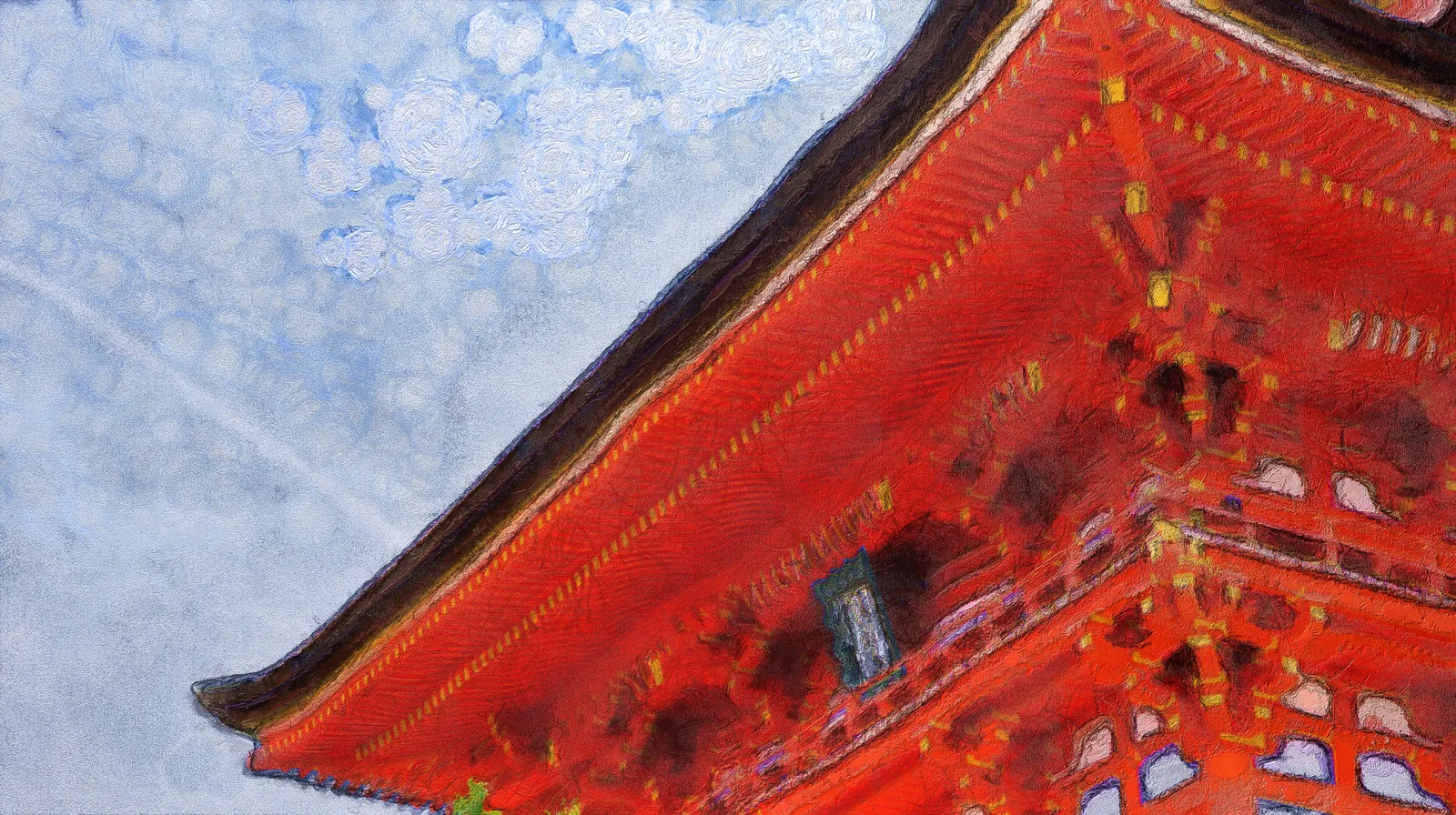 青い雲が広がる空を背景にした朱色の神社建築